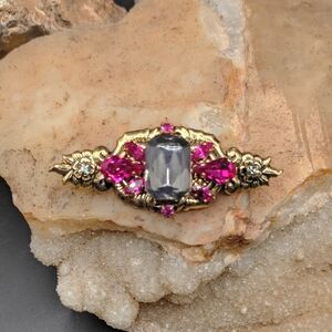 Victorian Revival Gold Tone Rhinestone Brooch With Smokey Colored Centerpiece.